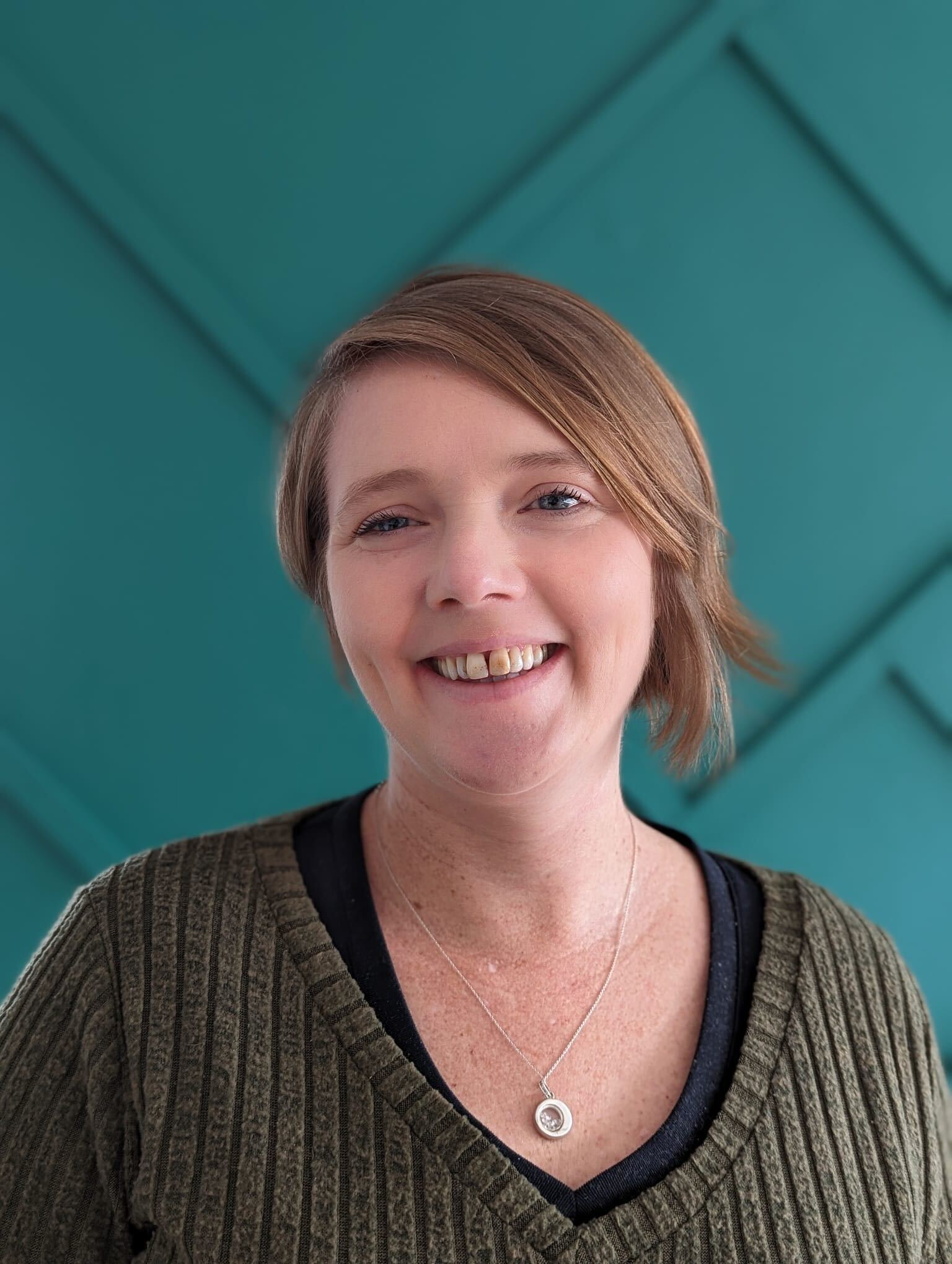 A profile photo of Kaye. She's white, with short blonde hair and blue eyes.